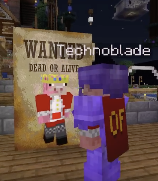 A screenshot from someone's stream. It shows Technoblade standing in New L'manberg looking at a wanted poster of himself, asking for him dead or alive.